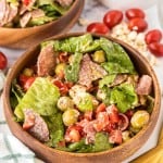two wooden bowls with antipasto salad
