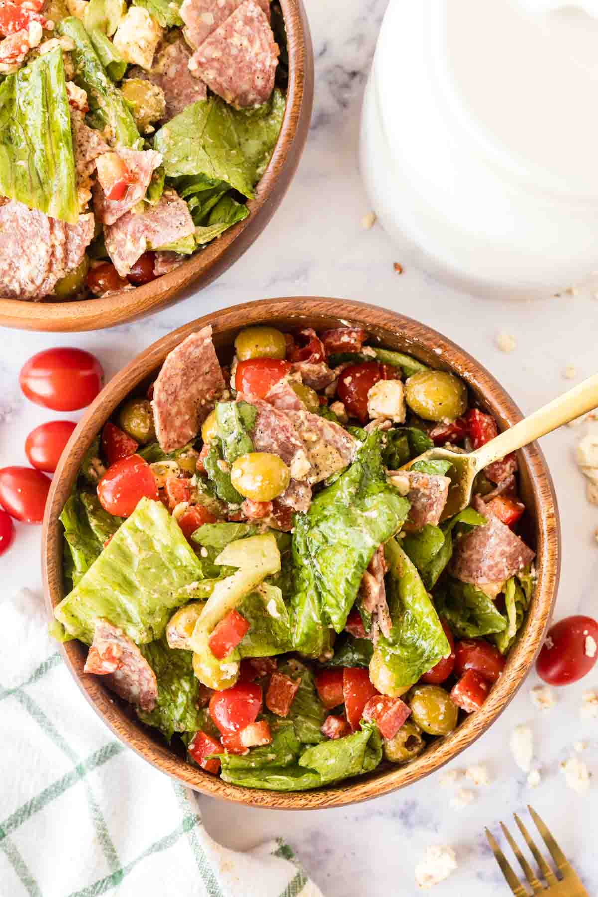 top view of antipasto salad in wooden bowl