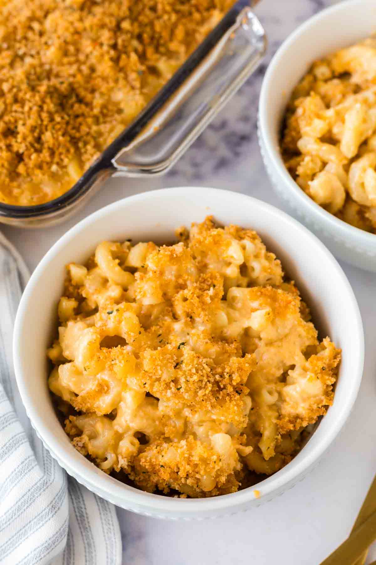 small white bowls with baked mac n cheese