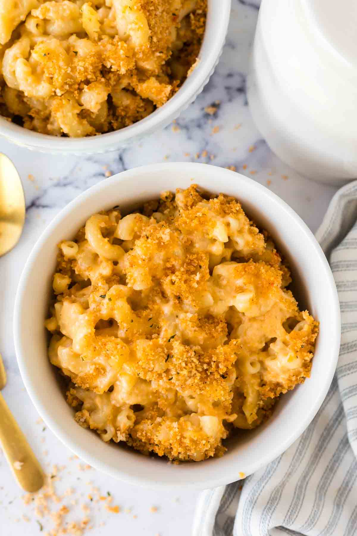 small white bowls with baked mac n cheese