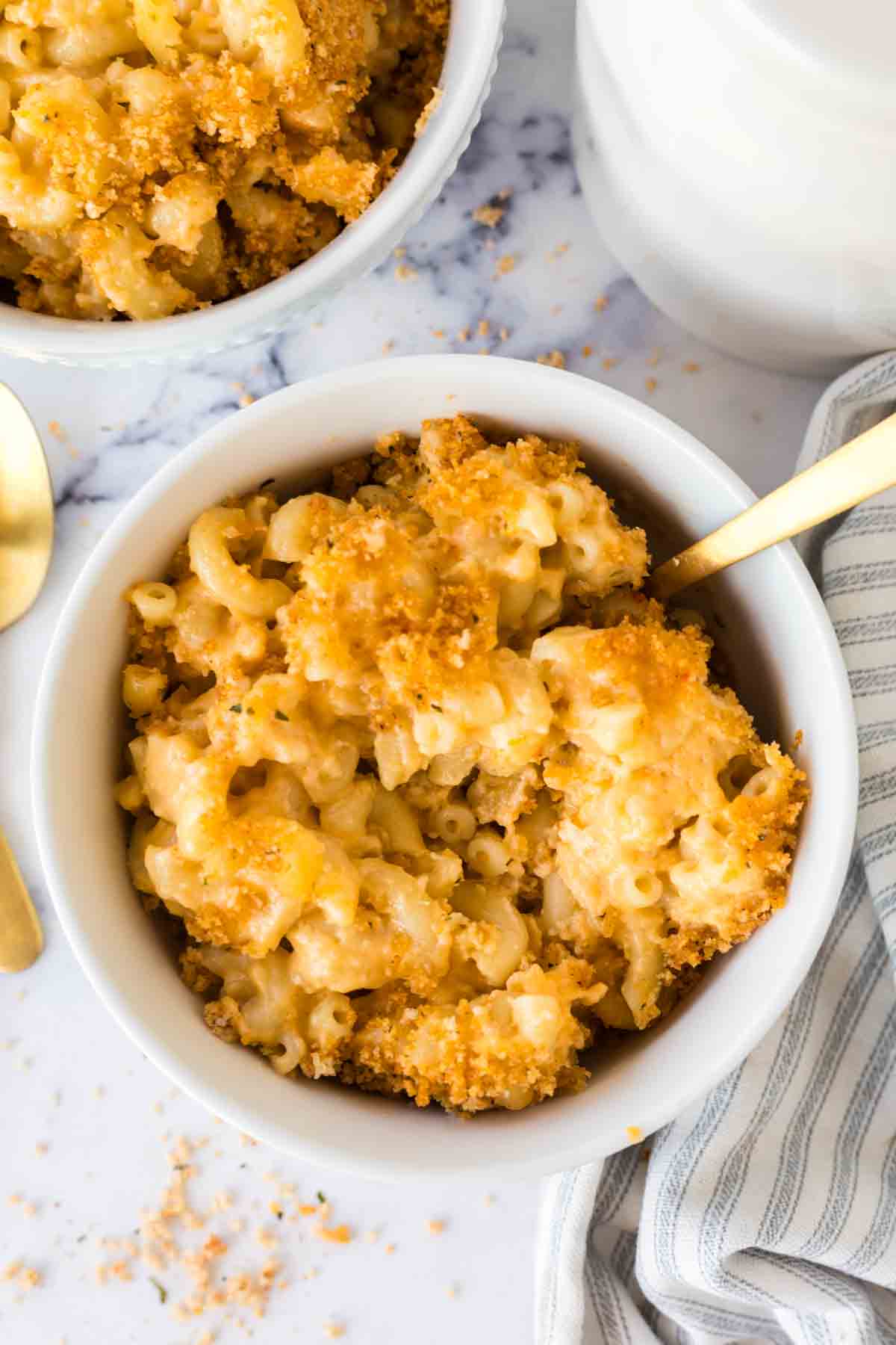 Baked Mac n cheese served in a white bowl.