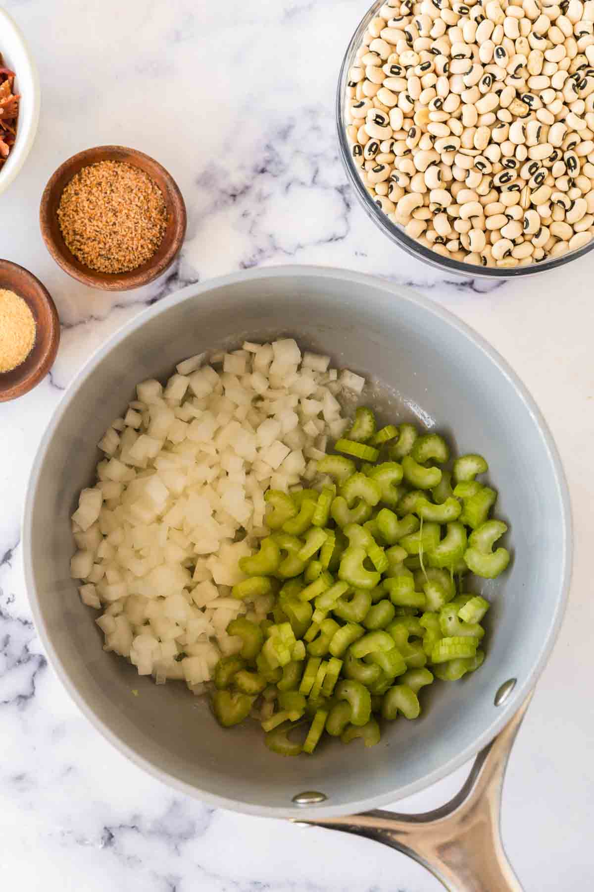 sauce pot with ingredients of black eyed peas