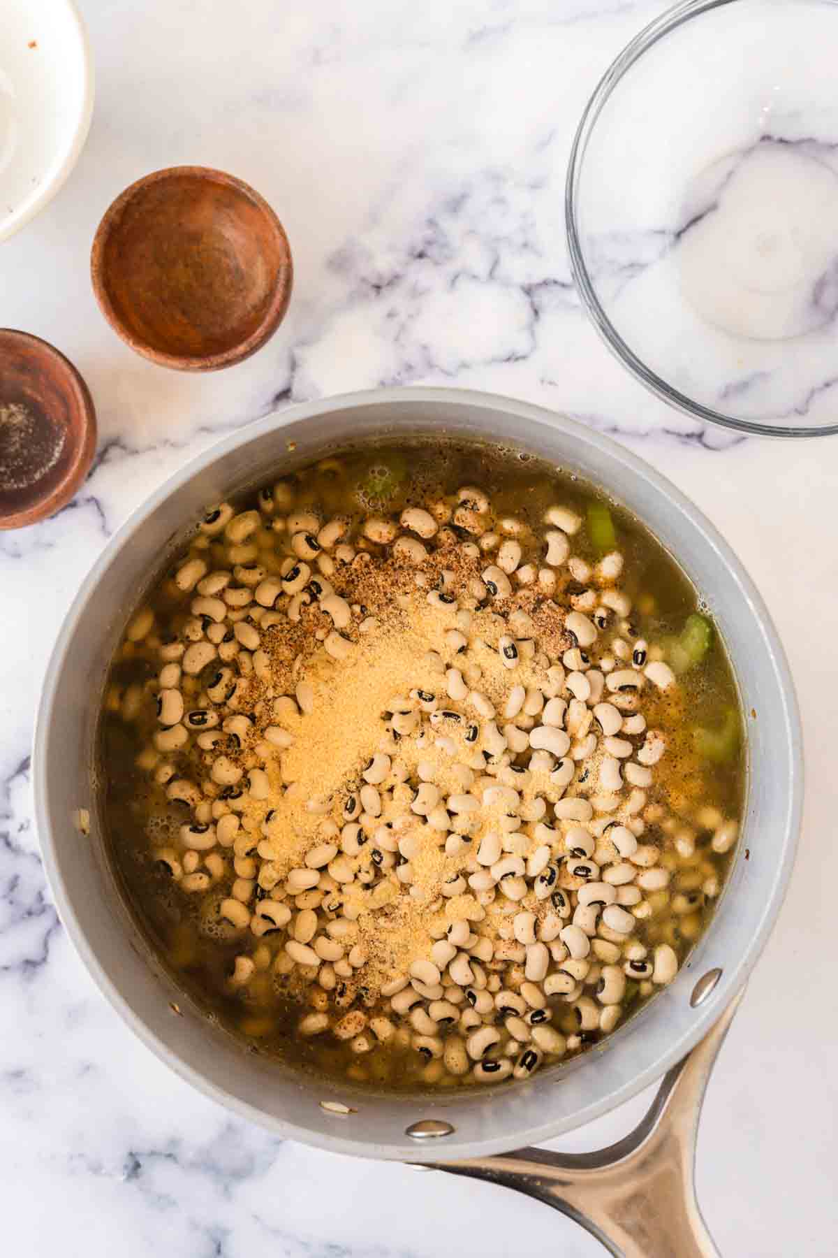 softening the beans in a pot with water