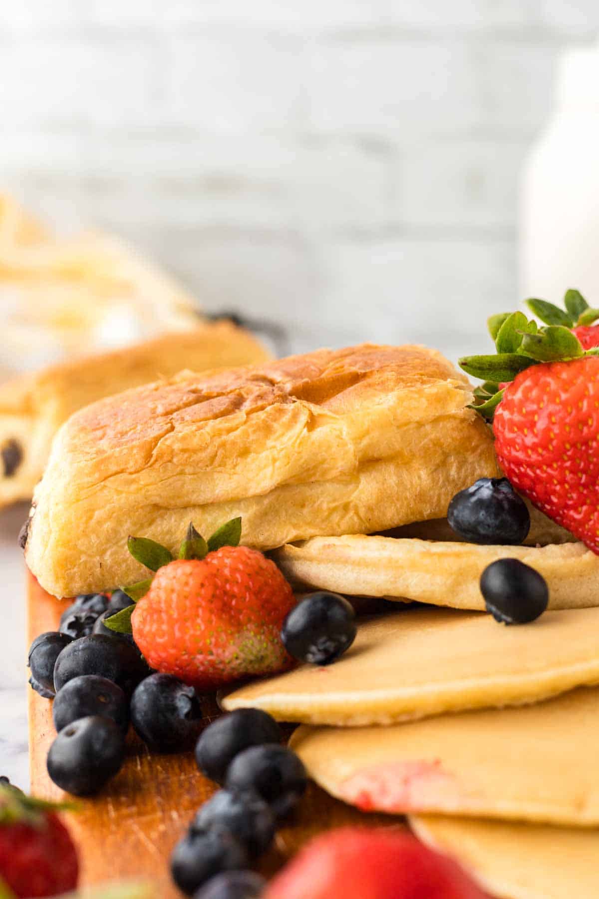 Delicious breakfast foods and fruits on display.