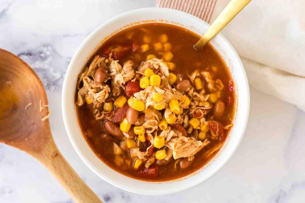 brunswick stew in a white serving bowl