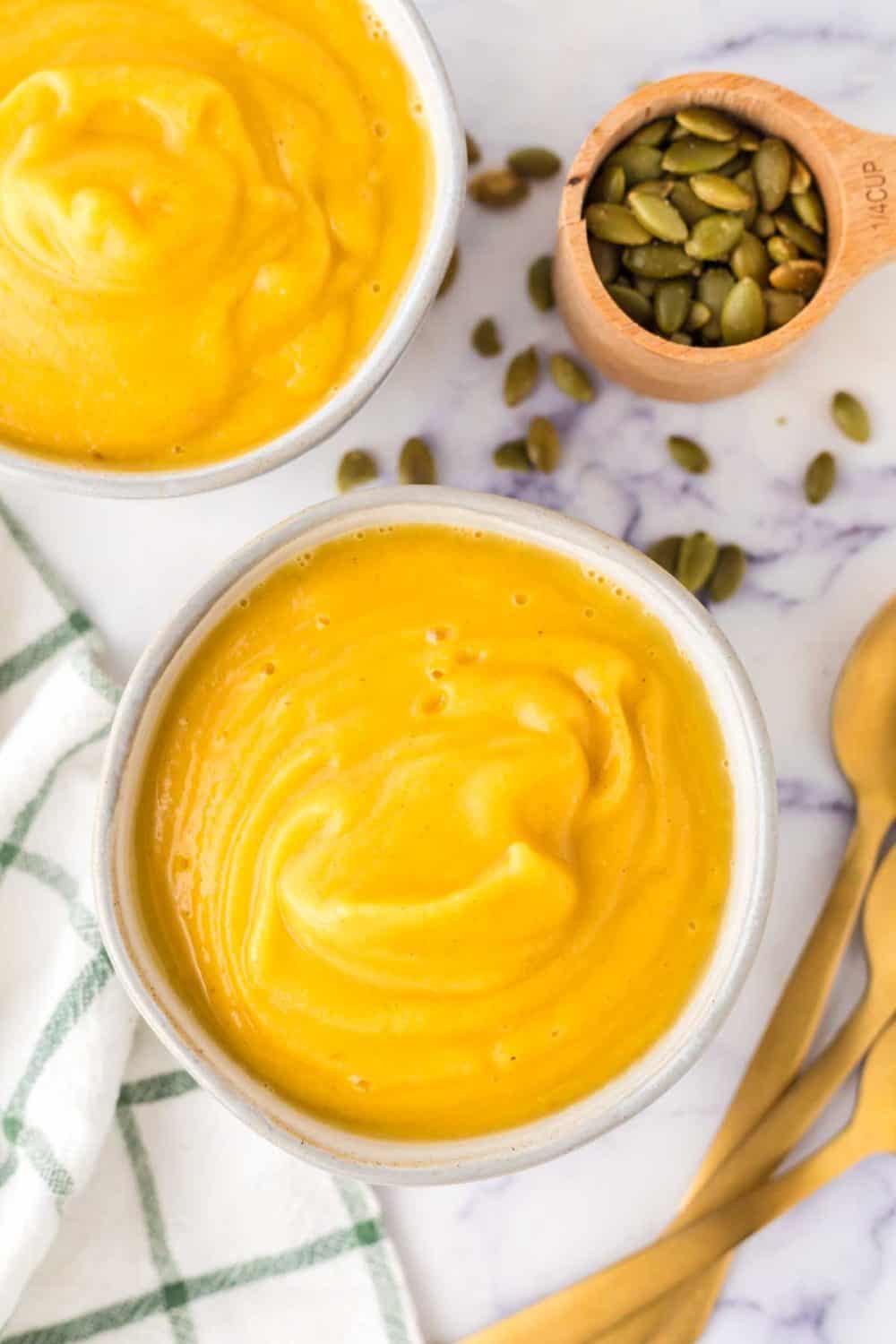 top view of a white bowl of roasted butternut squash soup