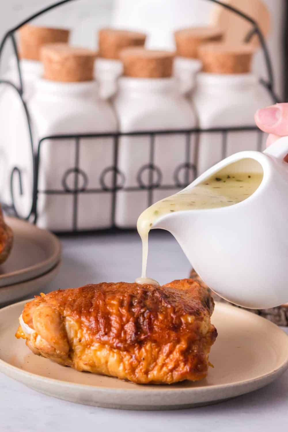 a white porcelin craft with chicken gravy being poured over