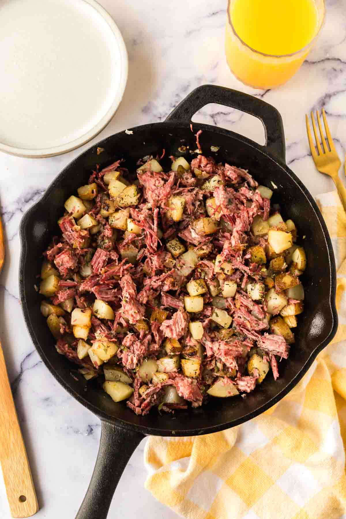 Completed corned beef hash in a skillet. 