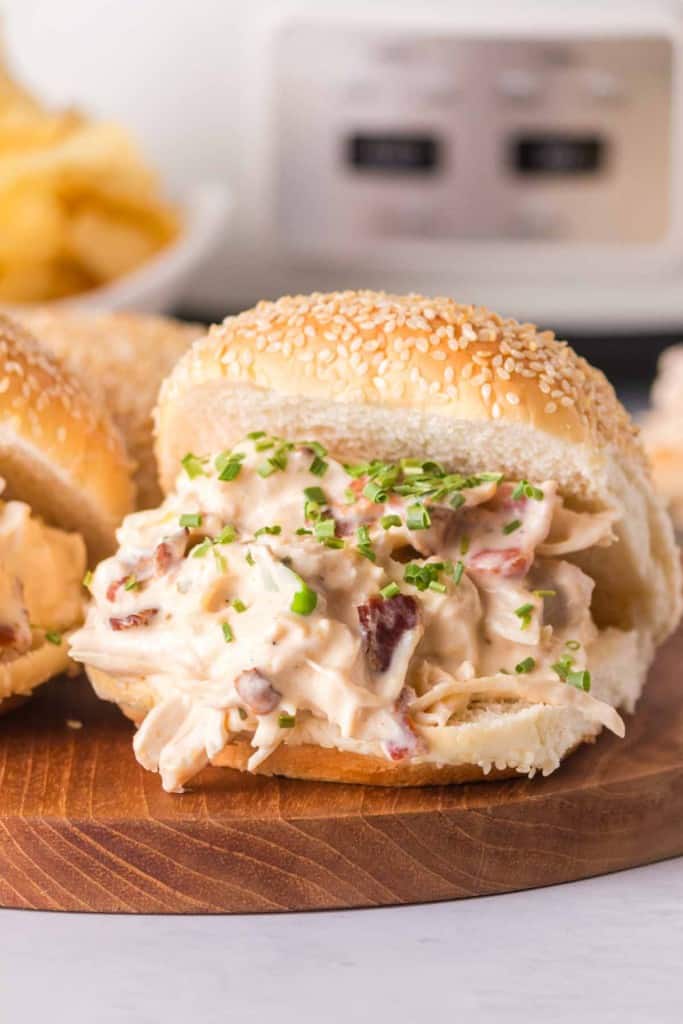 shredded and saucy crack chicken between sesame buns