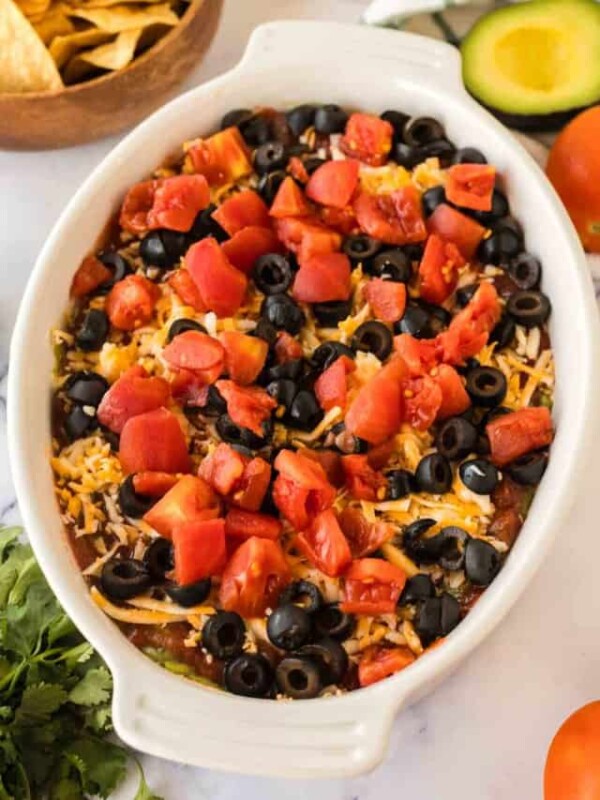 white baking casserole dish with 7 layer dip.
