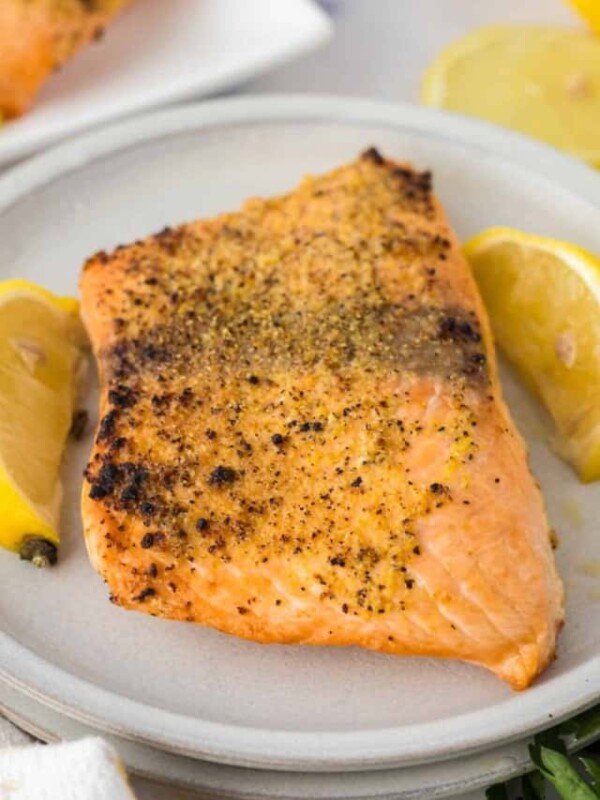 top view with a round plate and lemons with air fryer salmon recipe