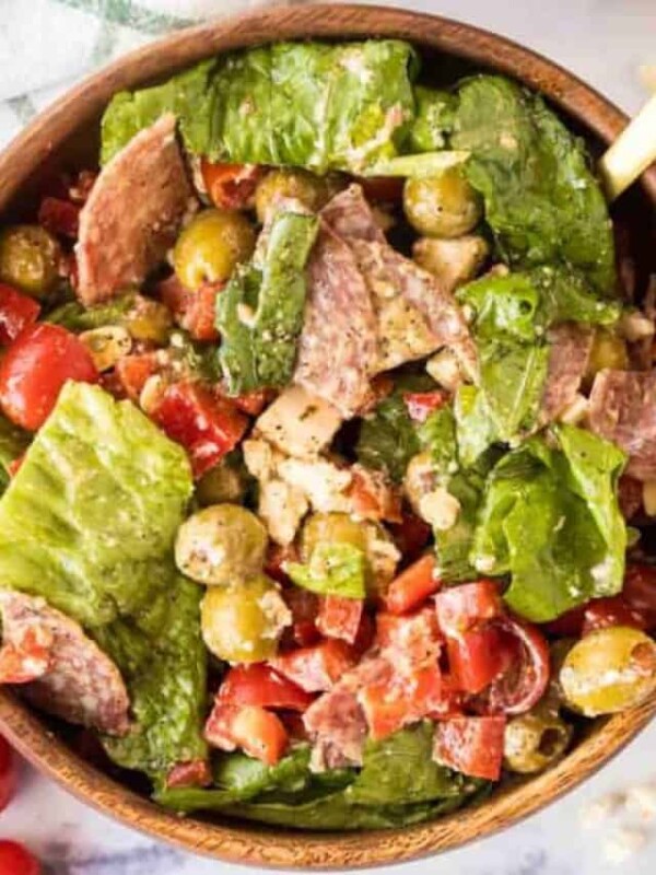 top view of a wooden bowl with antipasto salad