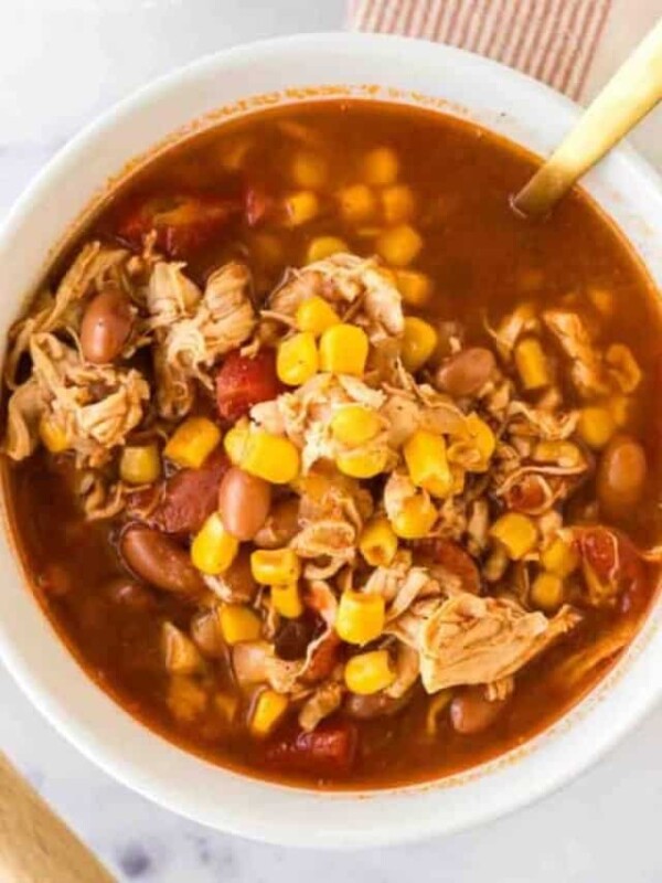 brunswick stew in a white serving bowl.