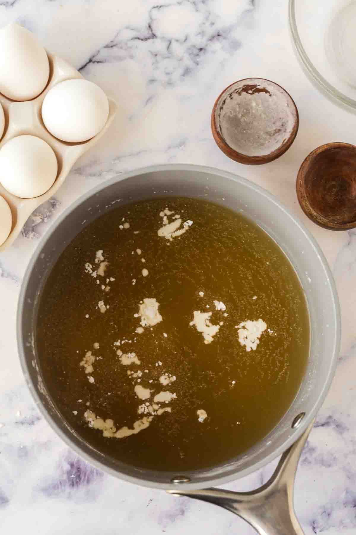 a pot with ingredients of egg drop soup