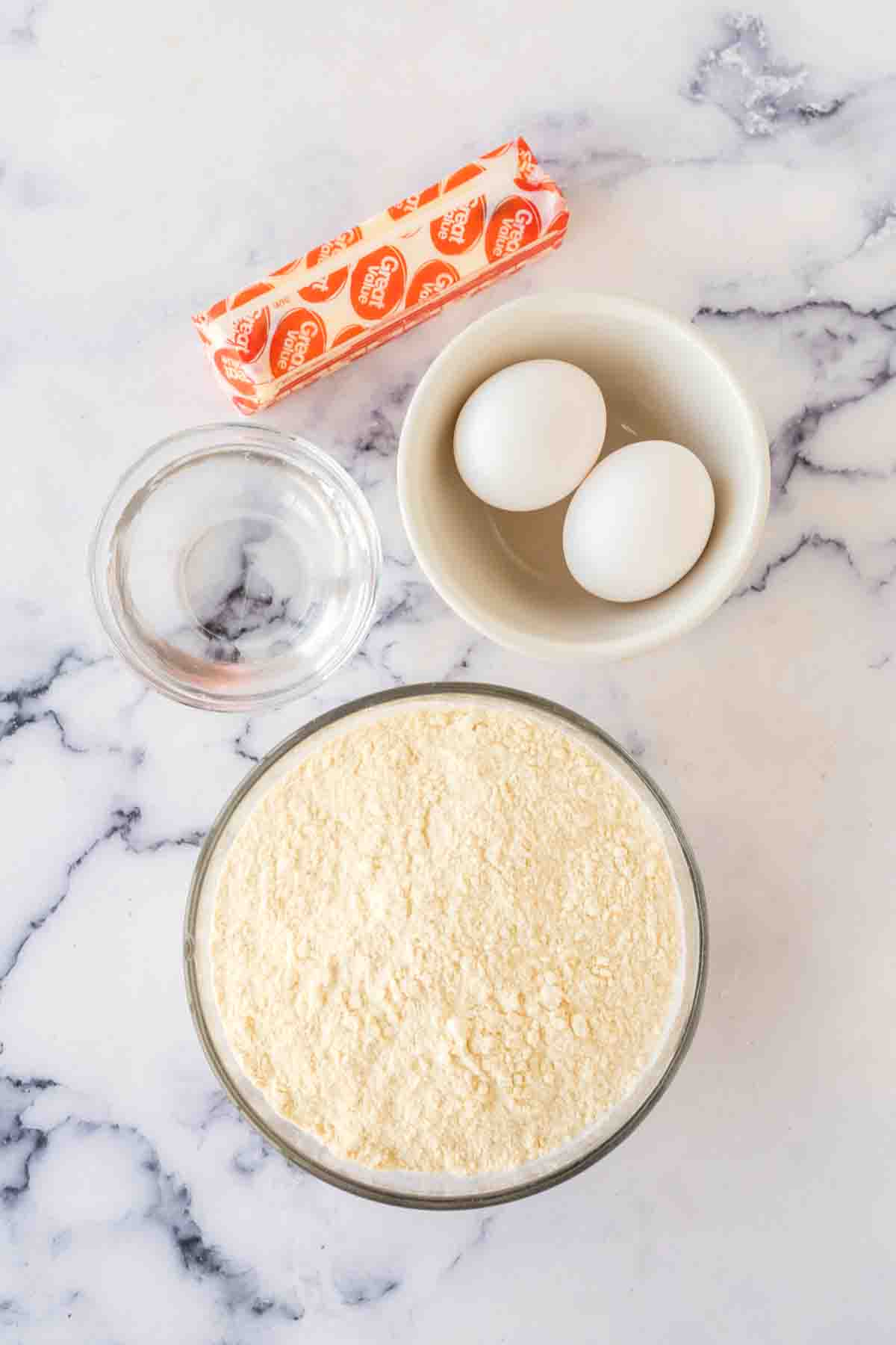 mixing bowl with ingredients for the empanada dough