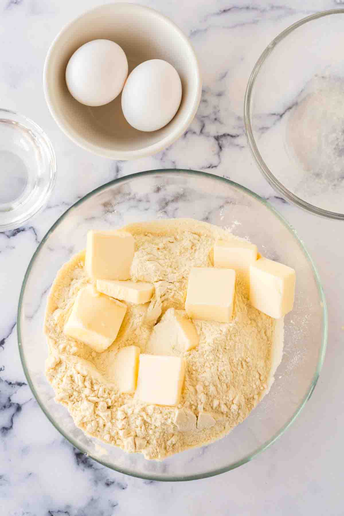 clear mixing bowl with dry ingredients for empanada dough