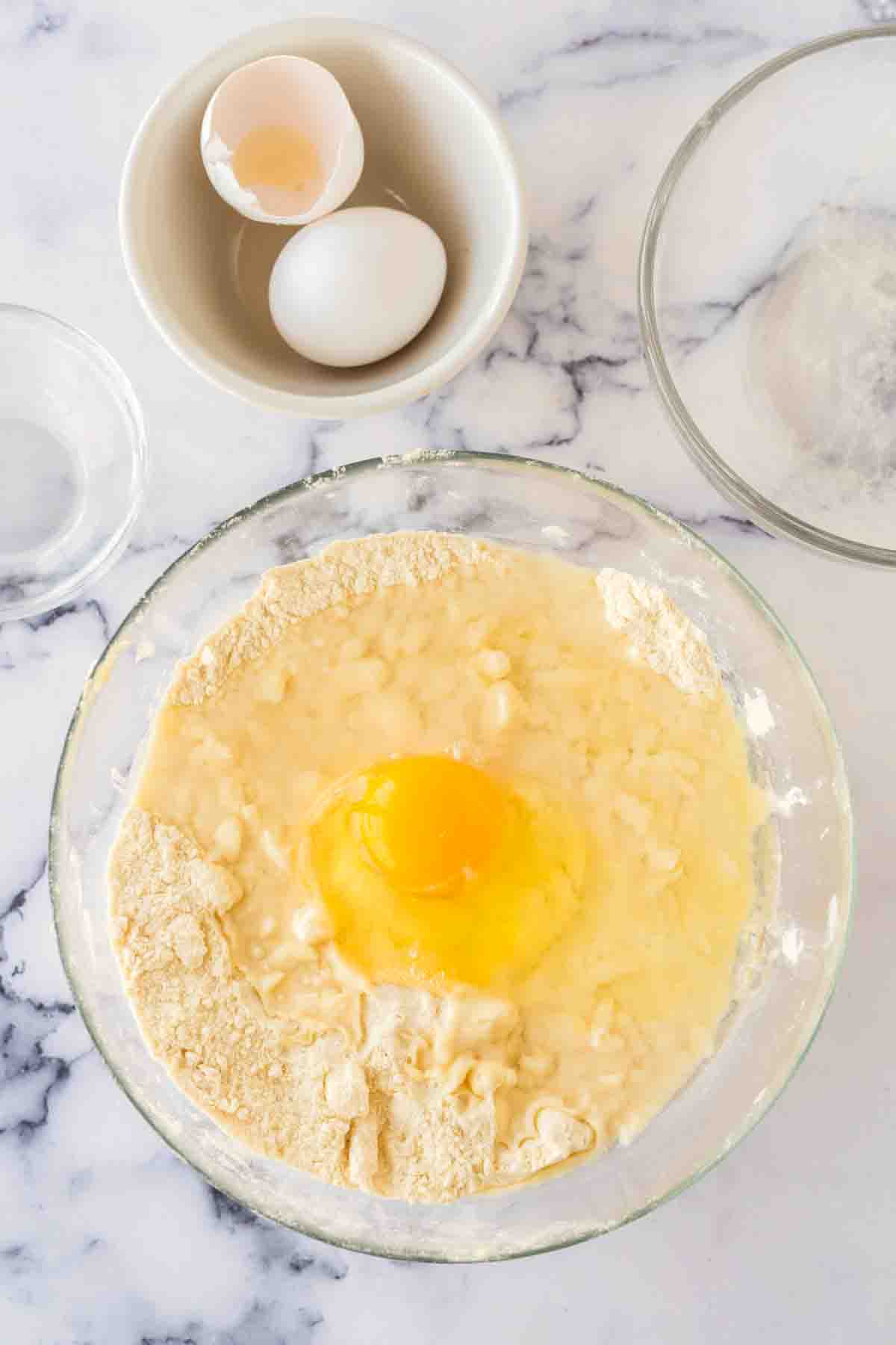 clear mixing bowl with empanada dough recipe