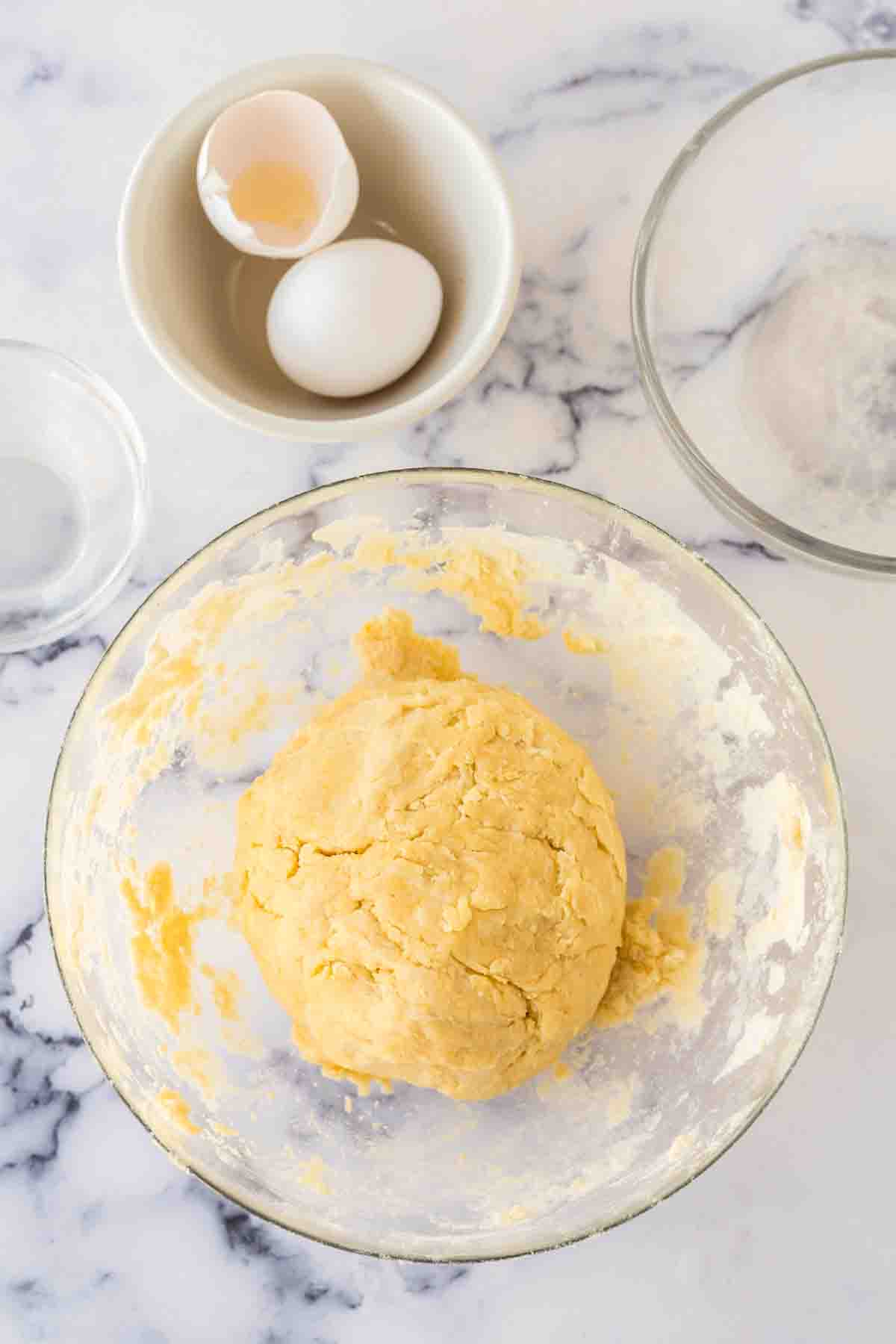 clear mixing bowl with empanada dough recipe