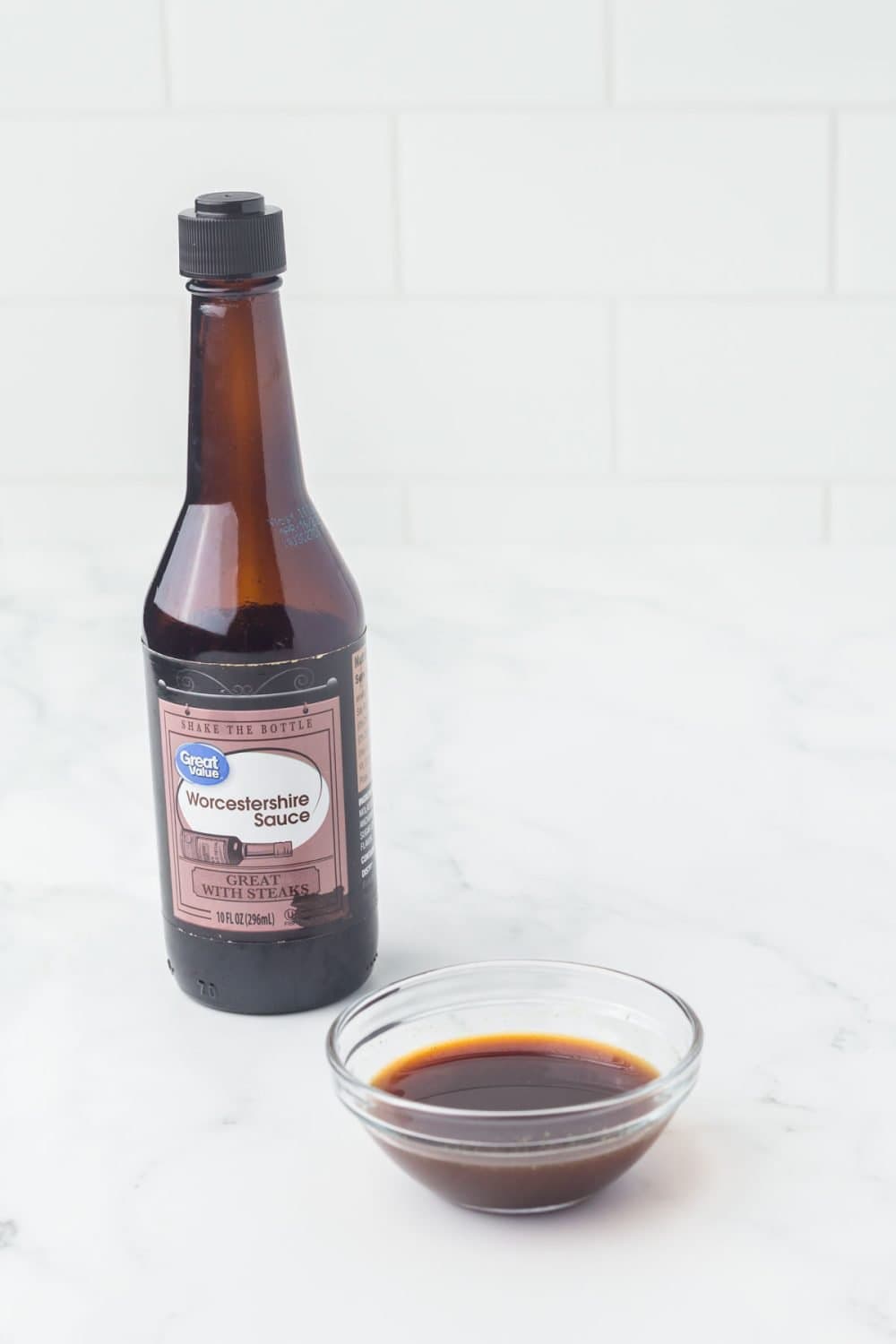 one bottle of Worcestershire sauce for fish sauce substitutes with a small clear dish in front