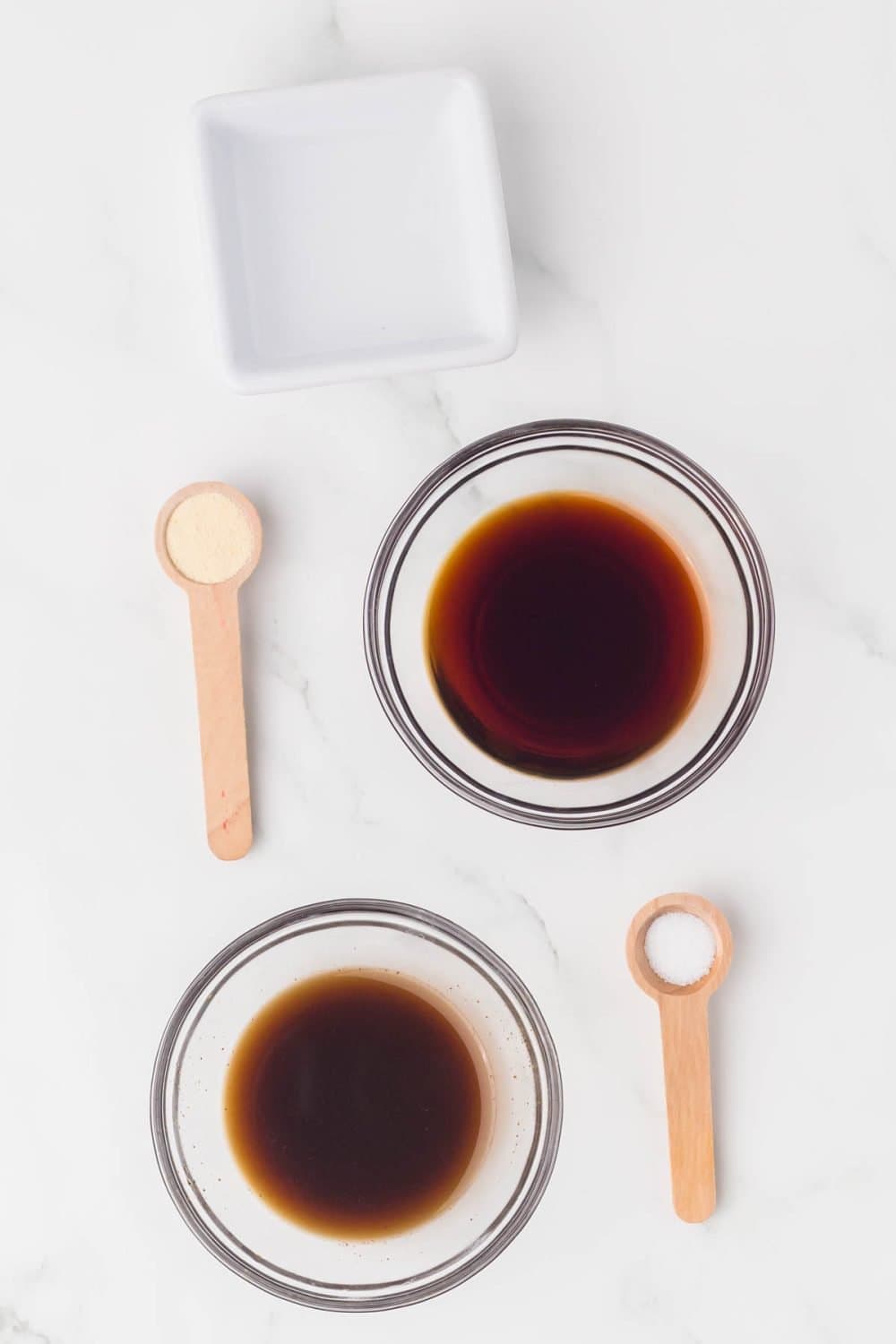 two clear small portion dishes with fish sauce substitutes