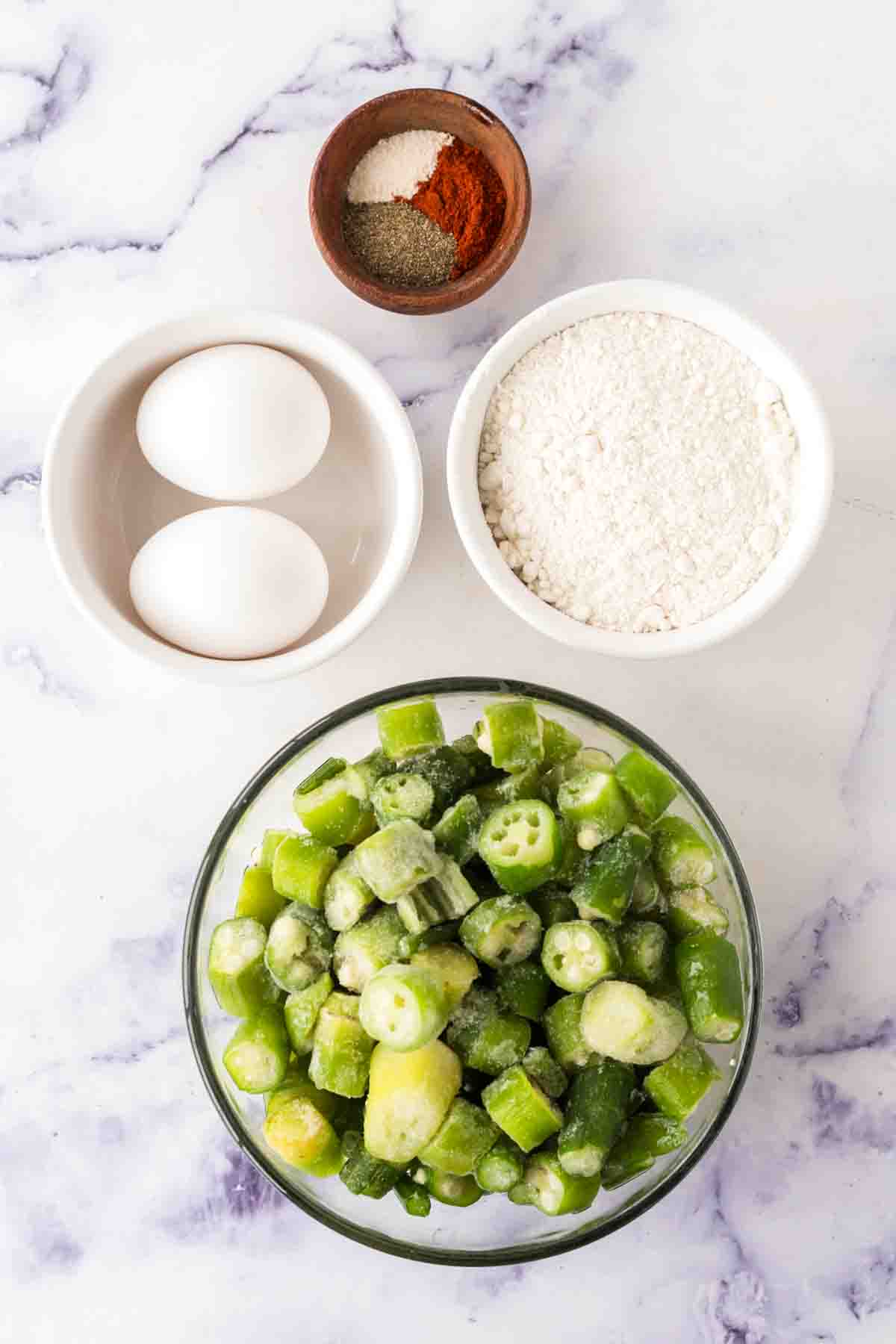small portion dishes of raw ingredients of fried okra
