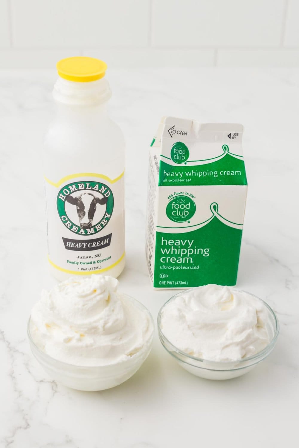 image of different containers of cream and heavy whipping cream next to two small clear bowls with cream