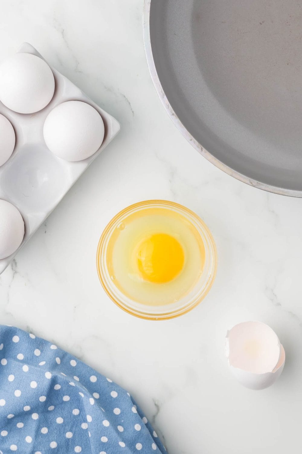 one egg in a small clear portion dish