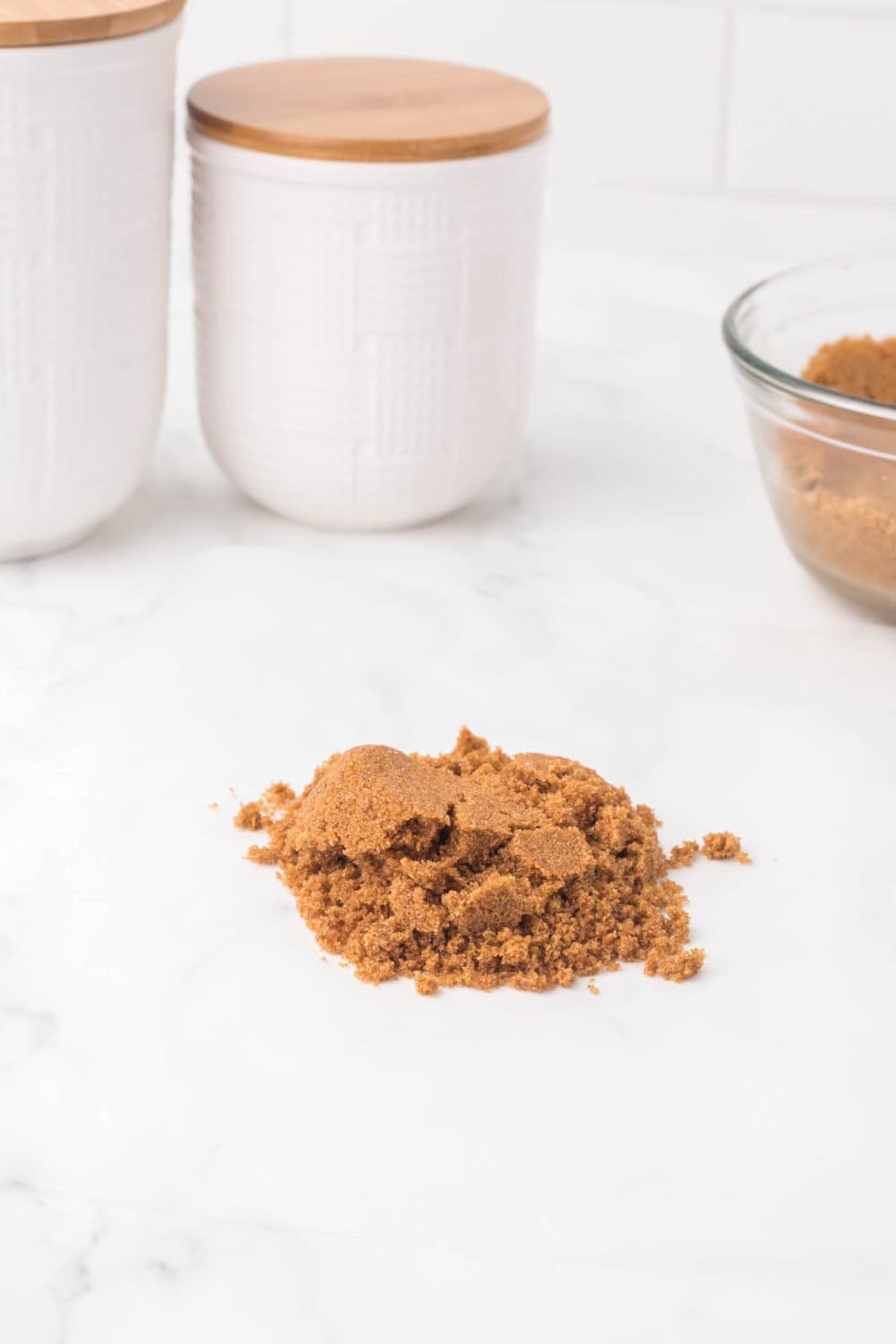 small pile of softened brown sugar on a white countertop