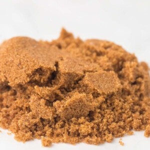 close up of small pile of softened brown sugar on a white countertop