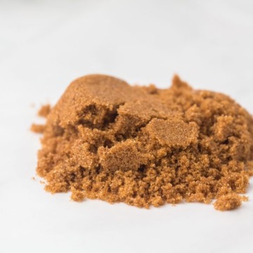 small pile of softened brown sugar on a white countertop