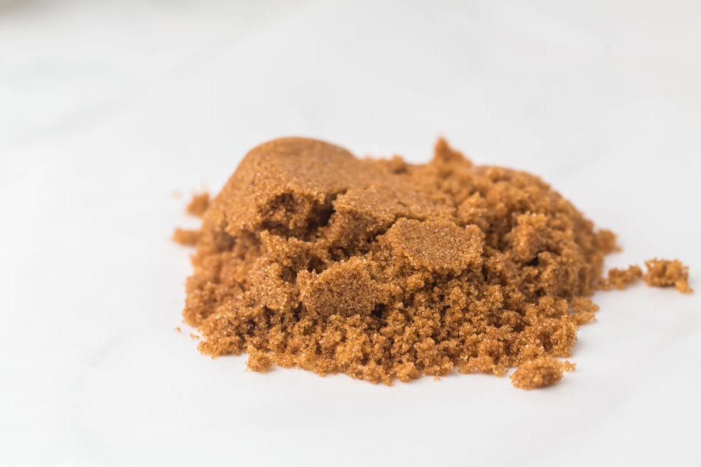 small pile of softened brown sugar on a white countertop