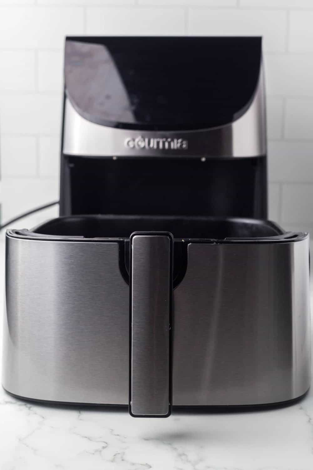 image of a clean stainless steel air fryer with the drawer pulled out