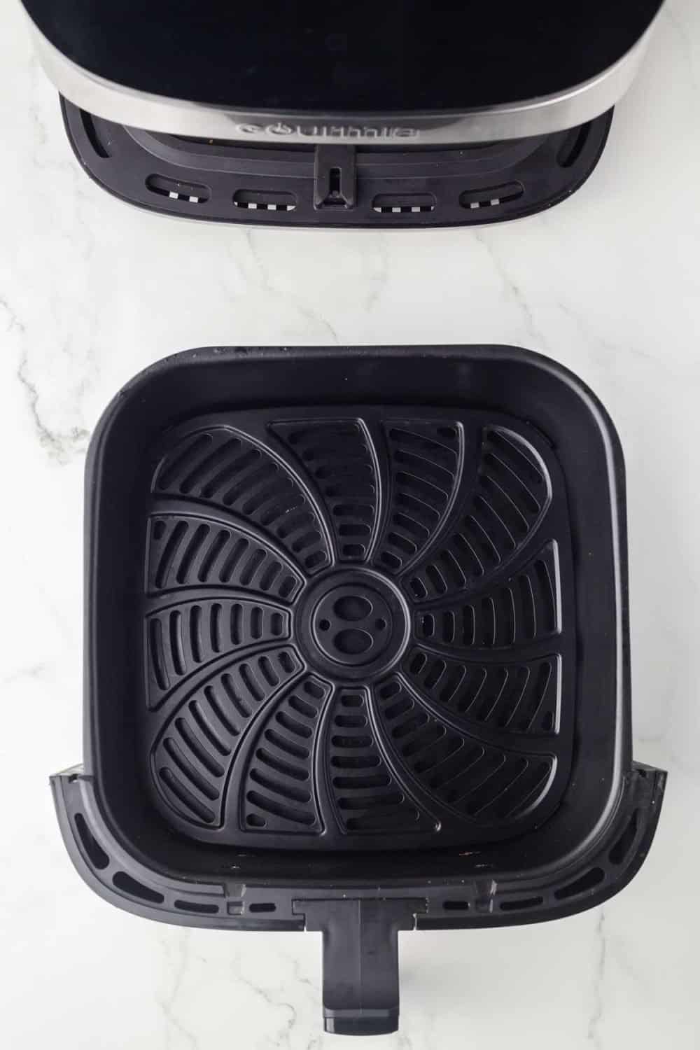 top view of an air fryer and empty basket
