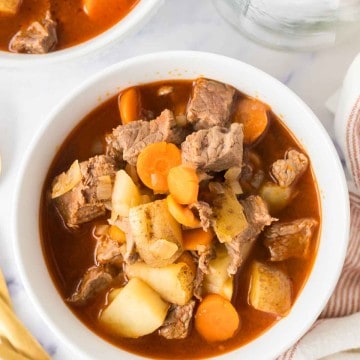 top view of a serving of Hungarian goulash in white bowls