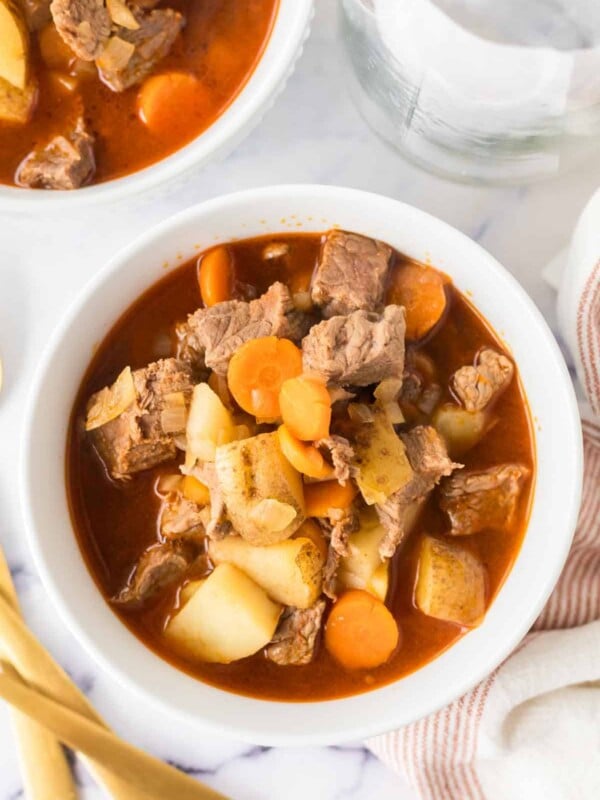 top view of a serving of Hungarian goulash in white bowls