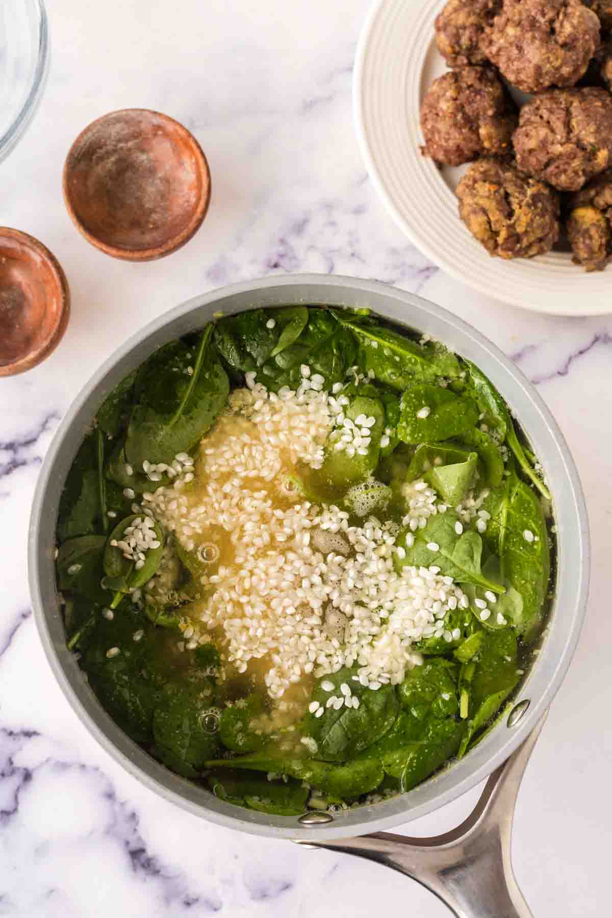 pot with raw ingredients of Italian wedding soup