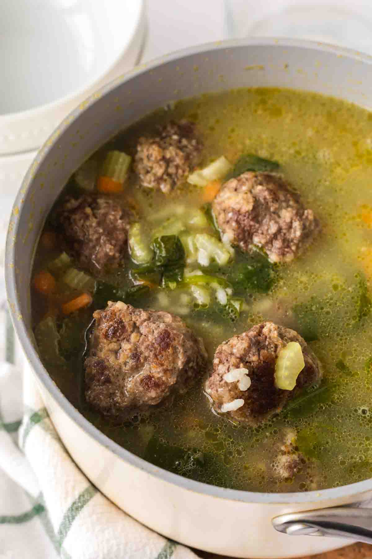 a sauce pan with Italian wedding soup