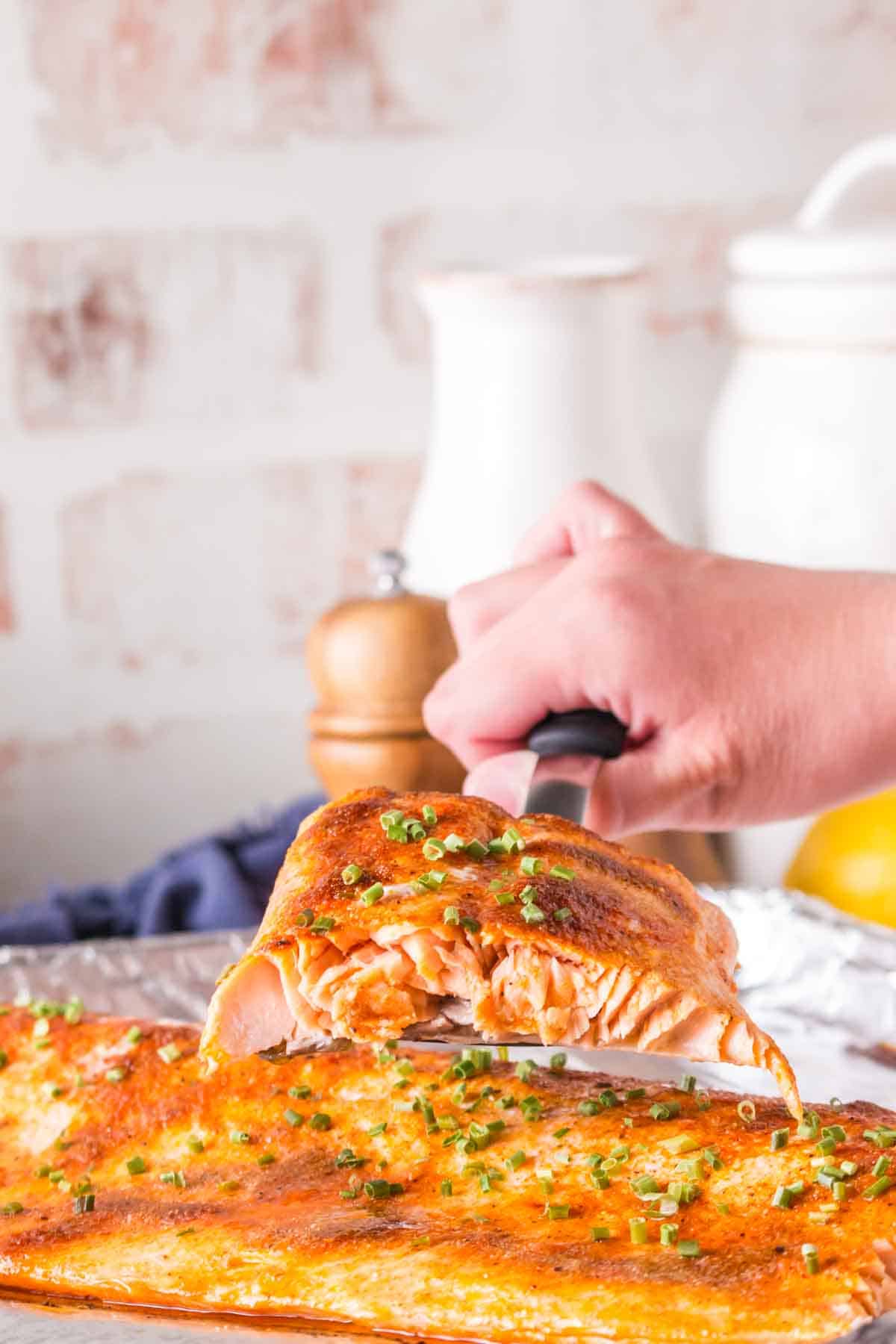 POV with a spatula of baked salmon