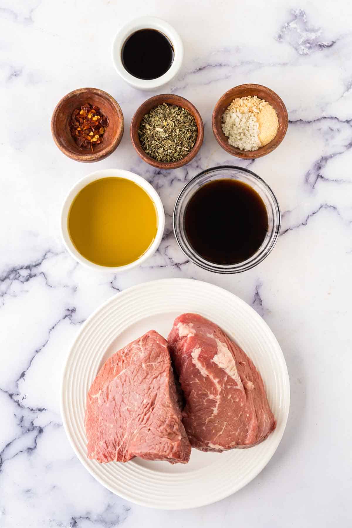 raw ingredients portioned for a steak marinade