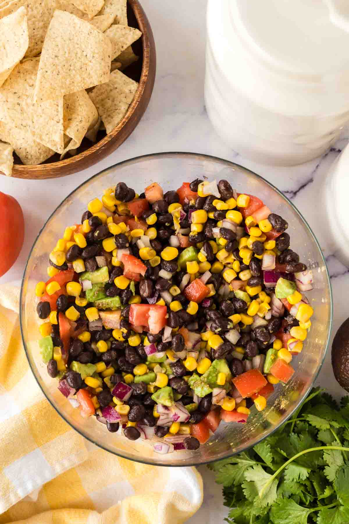 ingredients for texas caviar in a clear mixing bowl