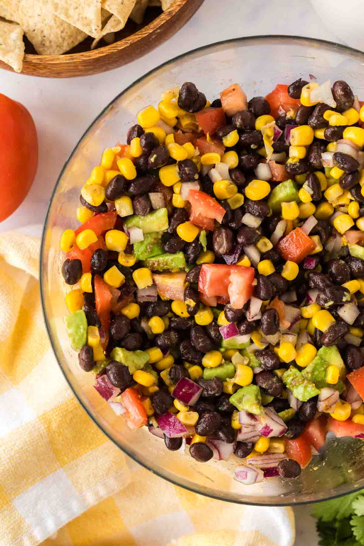 ingredients for texas caviar in a clear mixing bowl