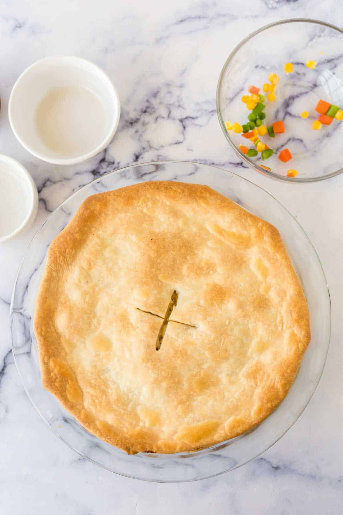 Finished turkey pot pie with an X in the center.