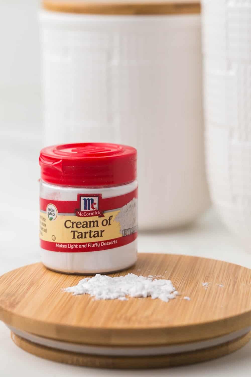 small jar of McCormick cream of tartar with a red lid