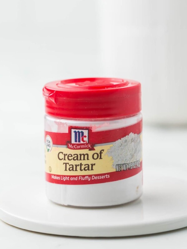 small jar of McCormick cream of tartar with a red lid