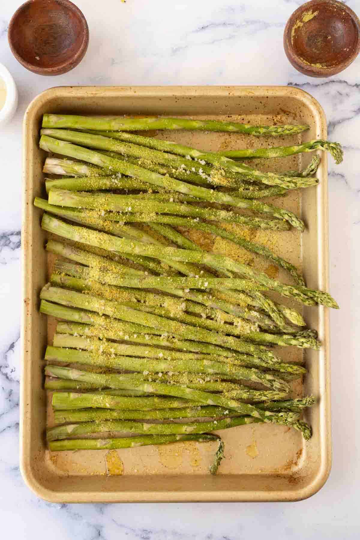 air fryer asparagus raw ingredients on baking sheet