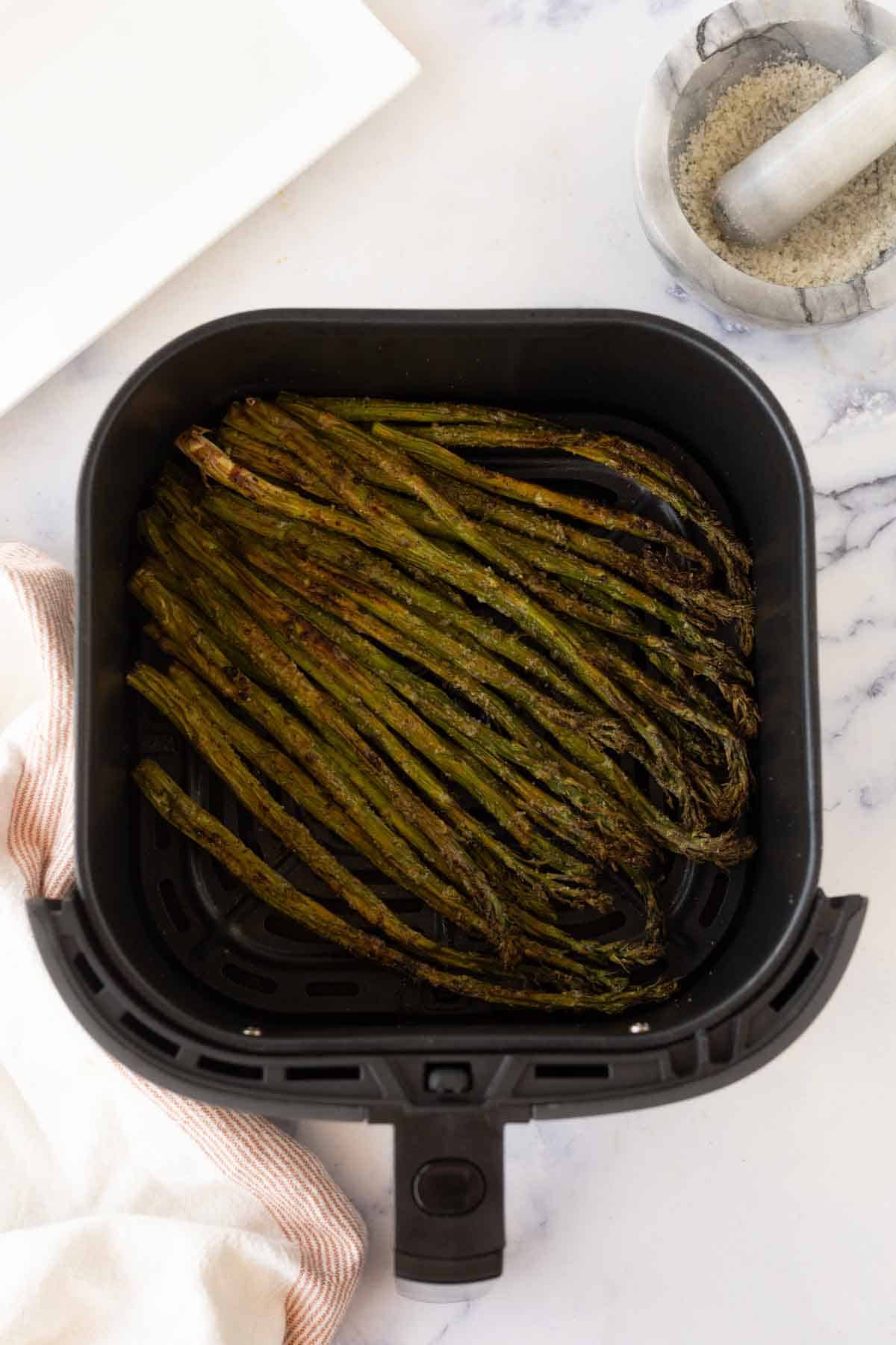 air fryer asparagus cooked in the basket
