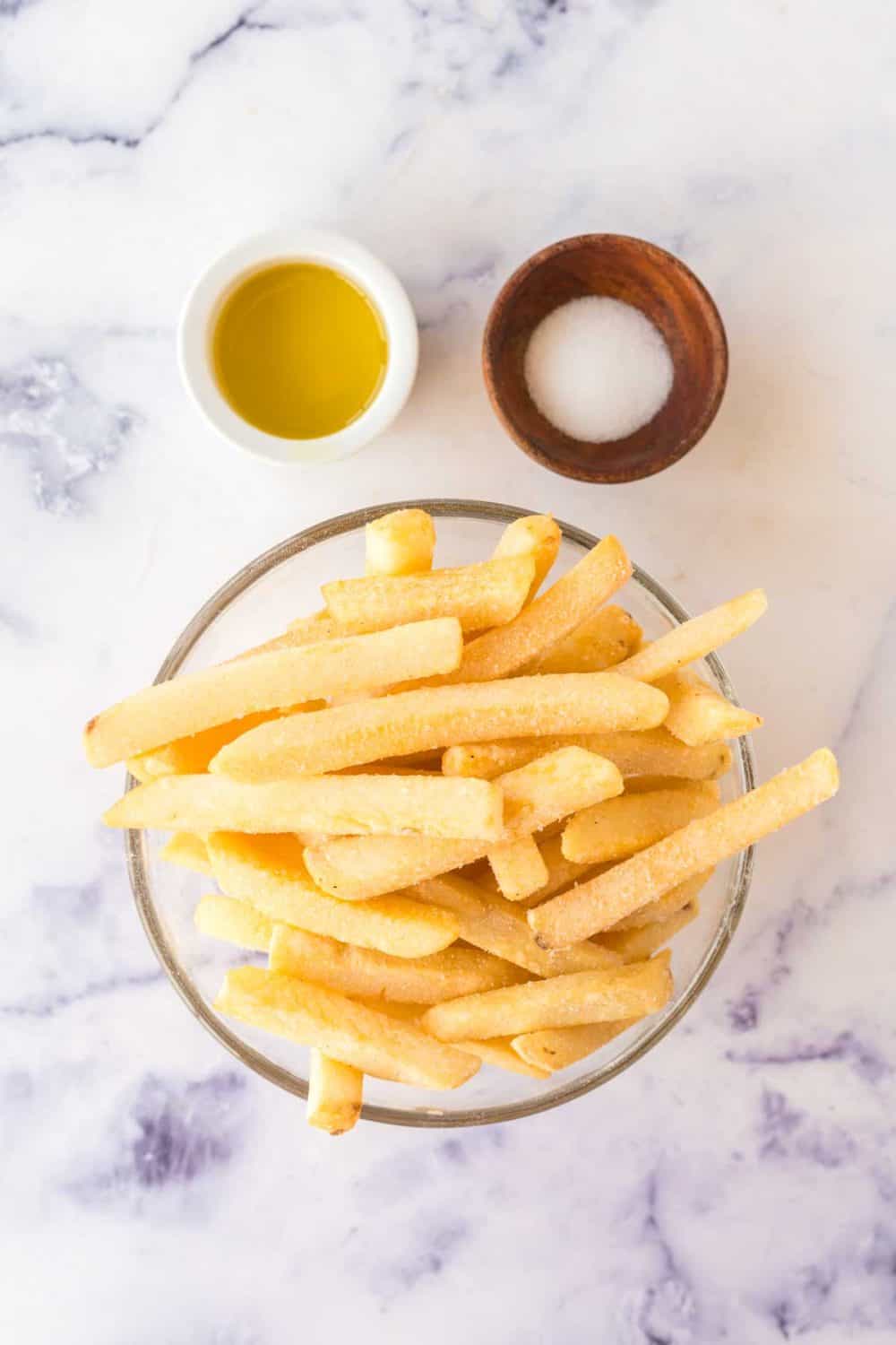 small bowls with ingredients for air fryer frozen fries recipe.
