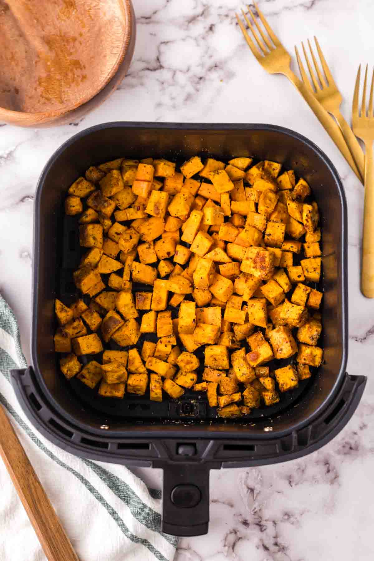 air fryer sweet potato cubes hot out of the basket