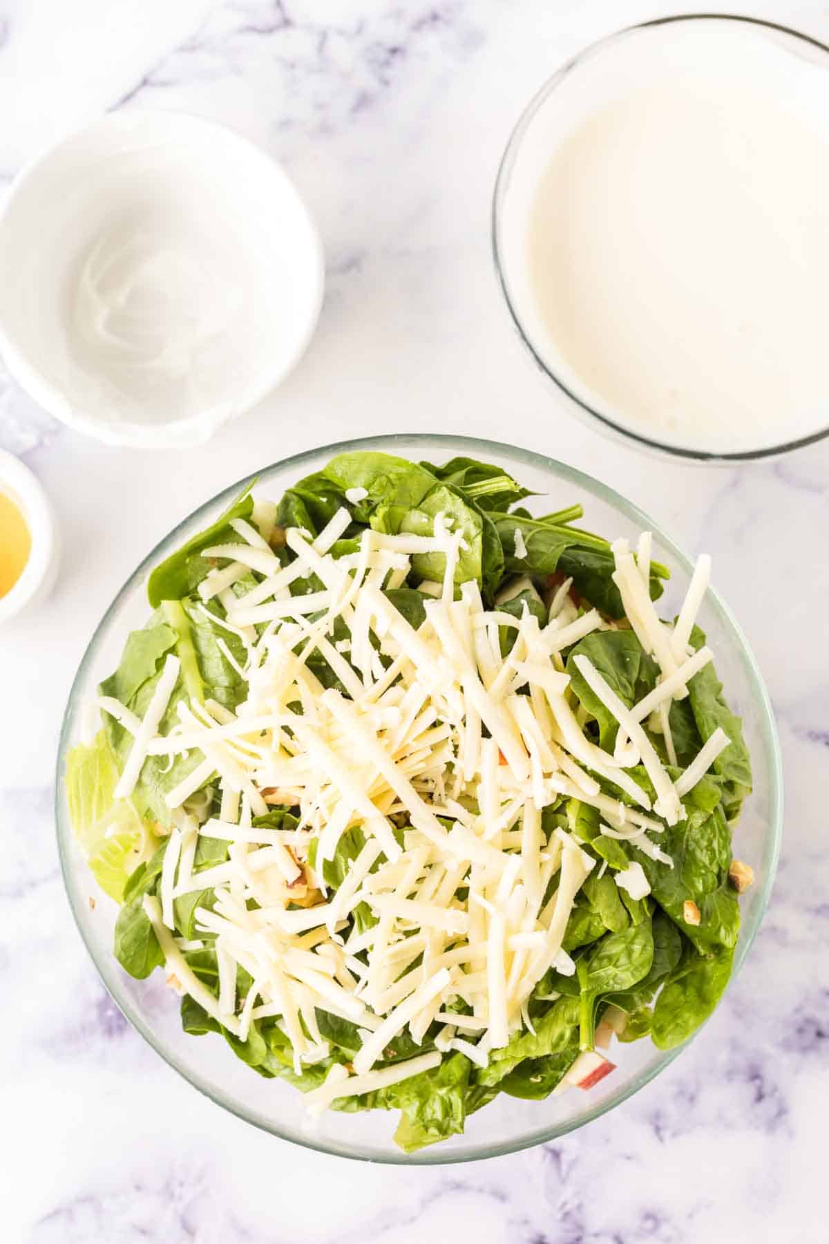 clear bowls with apple salad ingredients