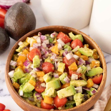 wooden bowl with avocado salad